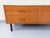 Small vintage sideboard or low chest of drawers in a Scandinavian modernist style from the 1960s, made of teak, with black...