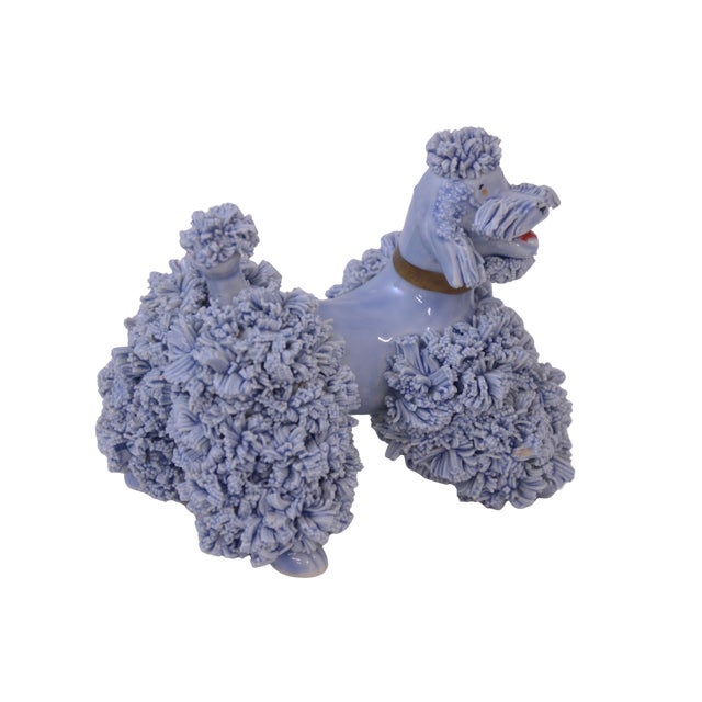 Vintage handcrafted highly textural blue gray poodle with hand painted gold, red, and black accents. No maker's mark....