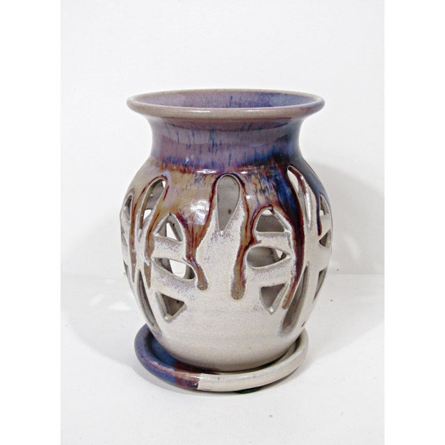 A signed studio pottery luminary candle holder with a matching small trinket dish / underplate. The piece has a sculptural...