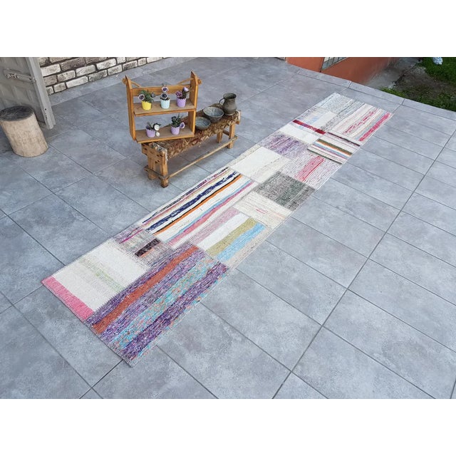 This is a vintage Turkish Oushak rug from the 1960s. The piece was hand-knotted.