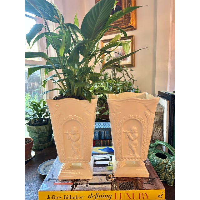 Late 20th Century Neoclassical Cream Ceramic Putti Pedestal Vases – A Pair For Sale In New Orleans - Image 6 of 12