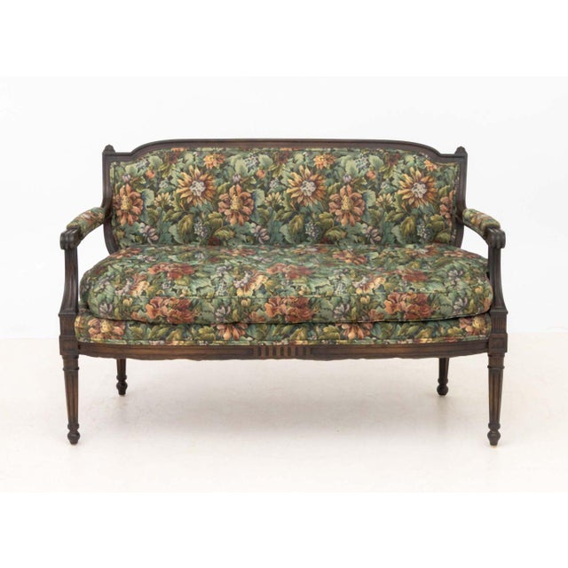 French Provincial Style Mahogany Sofa, with floral upholstery and cushion. 32" H x 49" W x 22" D. Provenance: The Estate...