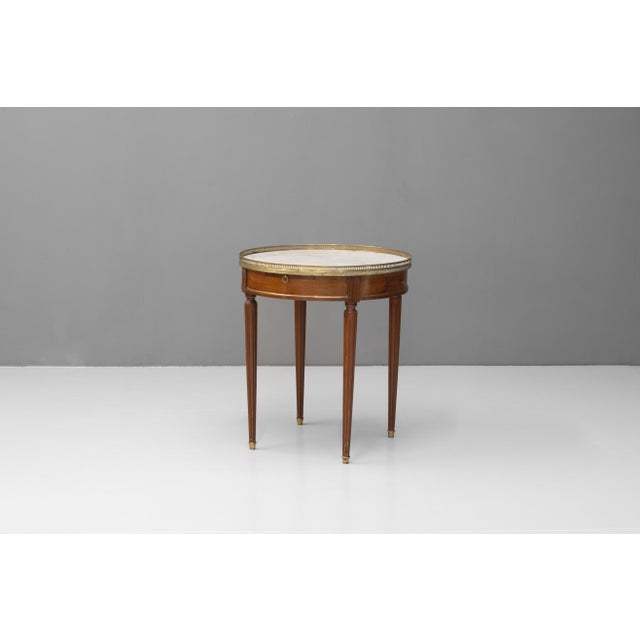 French marble topped mahogany games table with brass gallery. Circa 1900.