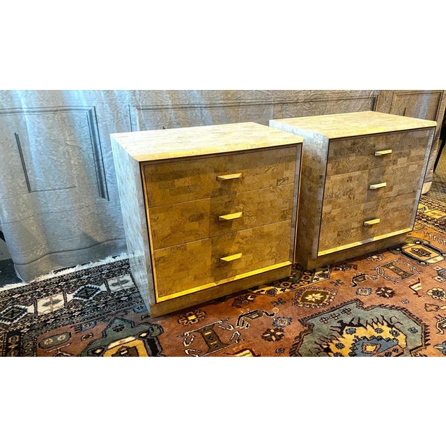 Gorgeous multi-colored tiles and unique hammered handles on this pair of tessellated stone nightstands by Maitland-Smith....