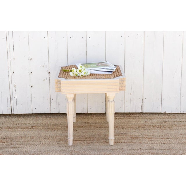 This British colonial side table stands gracefully on elegantly carved reeded legs, exuding a timeless charm. Its top...