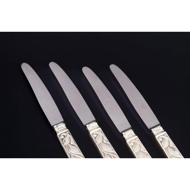 Evald Nielsen, set of four fruit knives. Elegant fruit knives in sterling silver and stainless steel with a classic softly...
