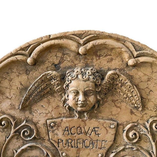 Wall fountain in red verona marble, composed of three modules: pedestal, basin and front. The pedestal is characterized by...