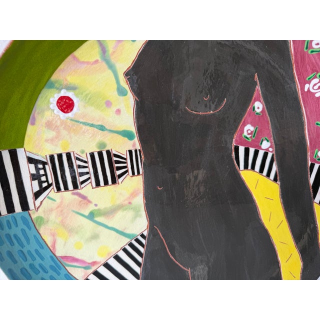 A striking 1980s hand-painted ceramic decorative plate by Lois Barton, featuring a bold modernist depiction of a female...
