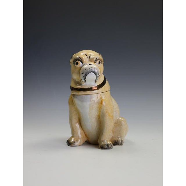 Staffordshire Pottery Seated Pug Tobacco Jar, Circa 1900 A charming and increasingly sought-after Staffordshire pottery...
