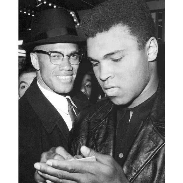 Malcolm X and Muhammad Ali Candid capture of Boxing legend Muhammad Ali smiling with Malcolm X at an event. In 1962, Ali...