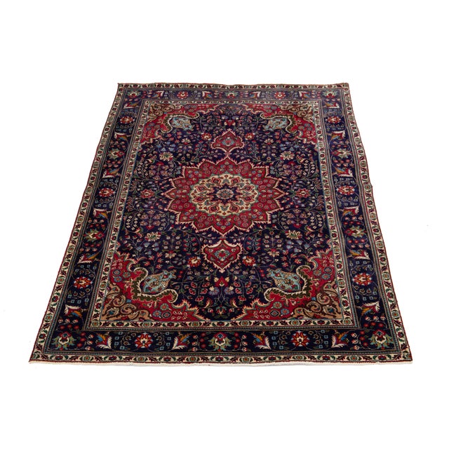 The Rosette Designed Handmade Persian Tabriz Wool Rug in Blue features an exquisite blend of artistry and craftsmanship....