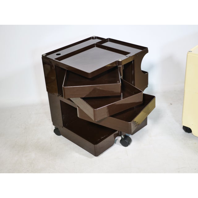 Two "Boby" rolling storage units made of plastic by Joe Colombo from the 1970s. Functional design with swiveling...