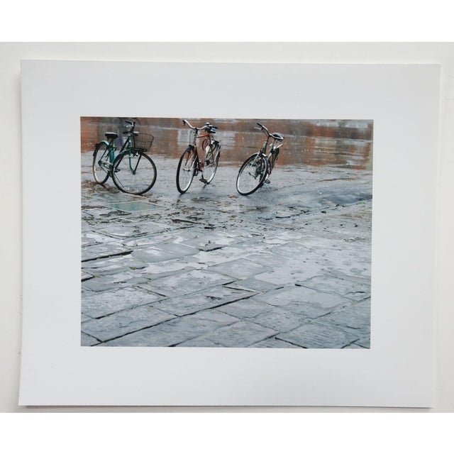 Small late 20th century photograph on glossy paper by Eric C. Weller (20th century) Texas. Street scene on a rainy day...