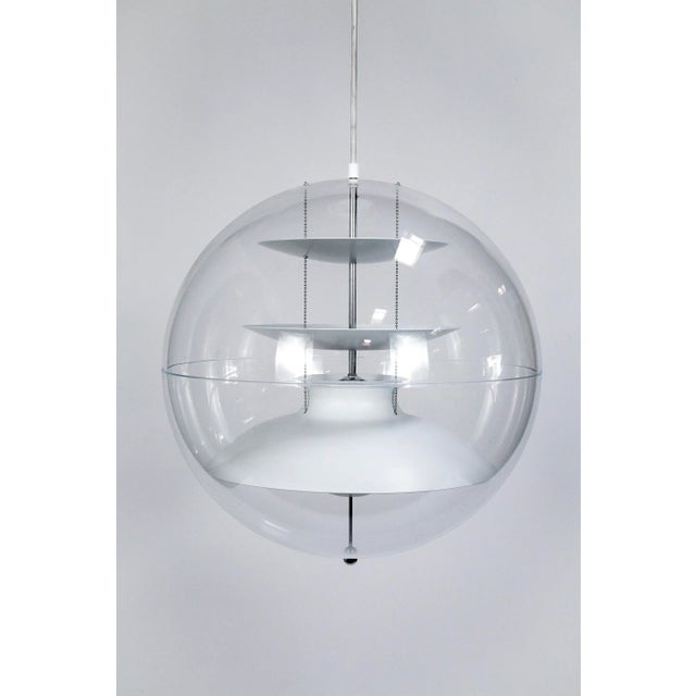 A recent production of Verner Panton's 1977 design, this pendant light comprises an acrylic transparent sphere and white...