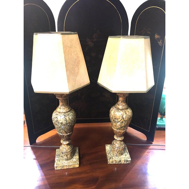This petite pair of antique Italian pink and black polished marble table lamps feature a neoclassic urn-shaped design on a...