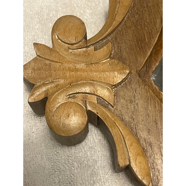 An authentic late 18th–early 19th century French hand-carved wood mirror frame, distinguished by its refined Neoclassical...