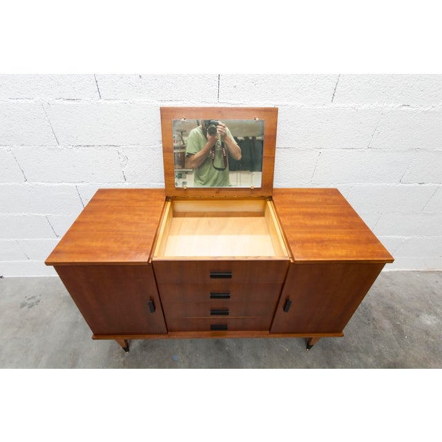 Teak dressing table/sideboard from the 1960s with four drawers (one fixed) and two doors. It is in superb condition with...