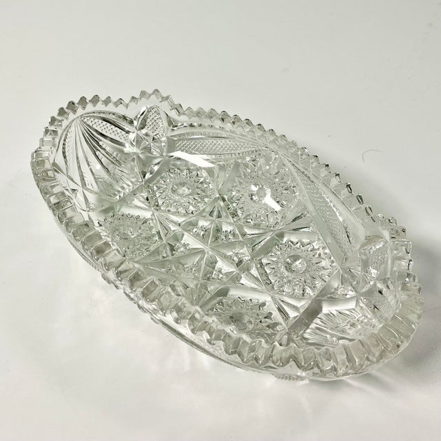 Between 1876 to 1916 American glass producers hand cut glass with sawtooth edging that became known as American Brilliant...