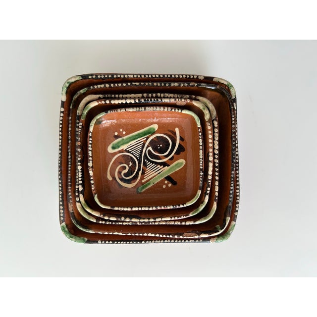 Clay pottery square trays hand painted redware in various abstract designs in green, black and cream color. Glazed...