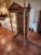 Beautiful antique vitrine...possibly for a religious statue. Opens from the back. Three sides are glass the top has finials.