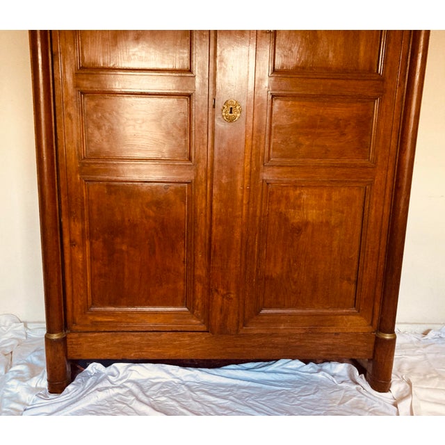 Antique French Empire Armoire Walnut, Columns to Either Side Front With Bronze Gilt Mounts Also Gilt Bronze Key Hole For Sale - Image 4 of 12