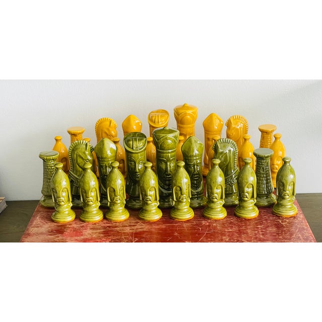 Unique ceramic figurine chess set with antique wooden flatware box.