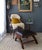 This leather and rosewood X frame ottoman or footstool features a dark espresso brown leather with a braided crosshatch,...