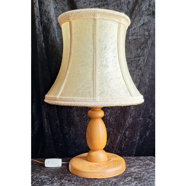 Vintage Table Lamp with Turned Teak Wood Base and Hand-Stitched Leather Shade, 1970s, in Very Good conditions. Designed...