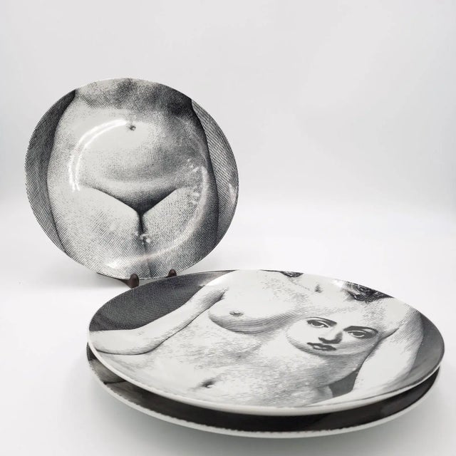 Three Fornasetti vintage plates.