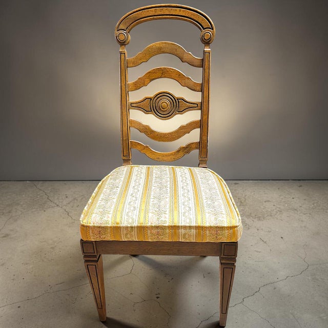 A complete set of 6 solid Pecan ladderback Thomasville dining chairs. The set consists of four armless side chairs and two...