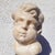 Green 17th Century White Marble Putto Head on a Column For Sale - Image 8 of 18