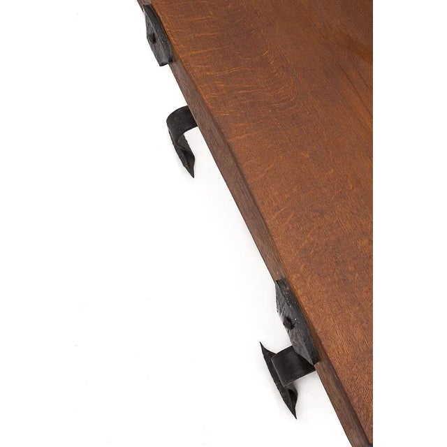 Brutalist coffee table. It has wrought iron base. 8 cm thick solid elm tray. In the style of Adnet/Rothschild. Circa 1950...