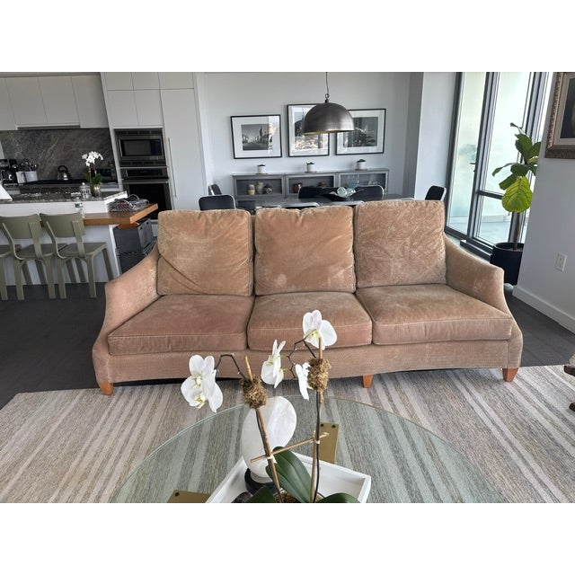 This is a Donghia Ogee sofa with a classic English look with Modernist style. The sofa has sloped arms, a serpentine...