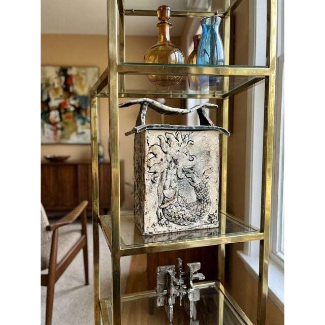 Add a striking, one-of-a-kind statement piece to your collection with this exceptional Mid-Century Modern studio art...
