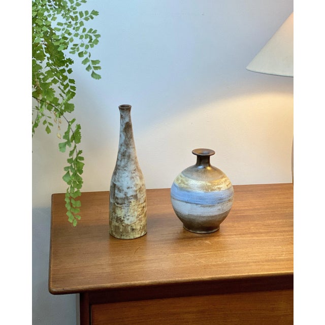A Mid-Century ceramic bottle / vase by Alexandre Kostanda (circa 1960s). This stunning asymmetric earthenware vessel...