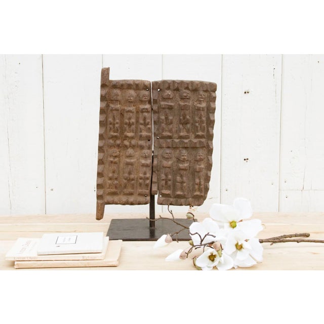 An enchanting piece of antique African craftsmanship, this small granary door of remarkable beauty. This antique African...