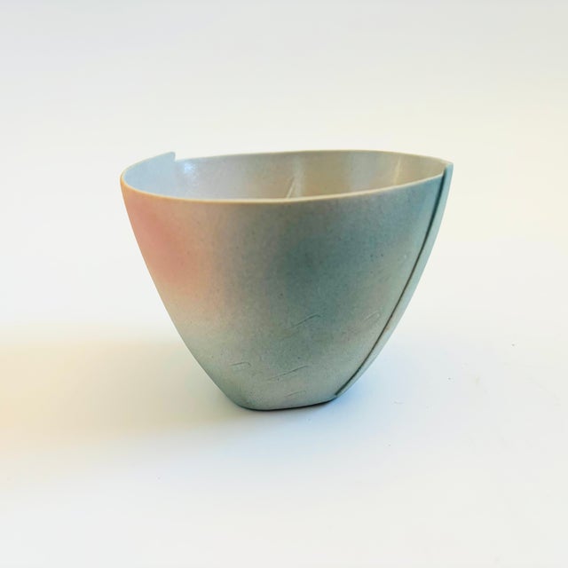 A vintage hand made pottery tea bowl by Japanese ceramicist, Kazuo Takiguchi (born 1953). Delicately formed from a single...