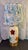 A charming 1950s table lamp with a cream-glazed ceramic body. It is hand-painted with large grape leaves in turquoise,...