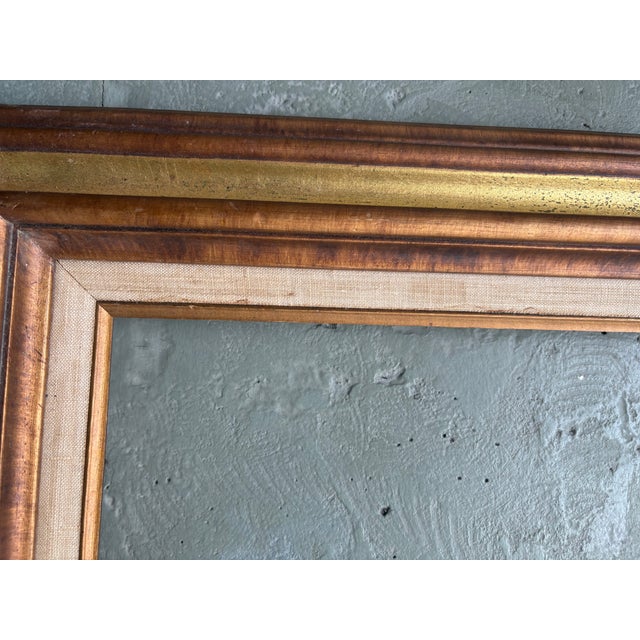 This handsome vintage picture frame was crafted in Mexico and features a substantial wood construction with a layered...