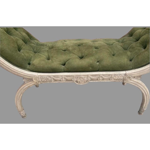 A vintage French style decorative boudoir or window bench with carved frame having high sides and curved legs with tufted...