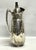 A vintage silverplate Wallace pitcher. The lidded pitcher includes an easy to remove lid, an ice lip and a large handle...