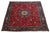 Explore the charm of this handmade vintage Tabriz rug, crafted from rich red wool. Adorned with an intricate rosette...