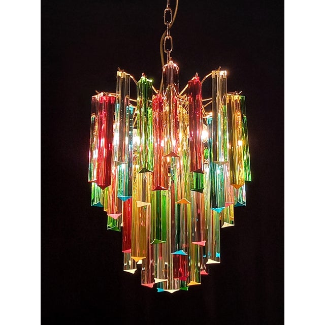 Vintage murano chandelier. With a round and alternating shape, in venini style, 70s, very particular and design. With no....
