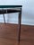 Pair of authentic Knoll Studio Florence Knoll side tables in chrome and glass. This is the smaller size 24x24 that appears...