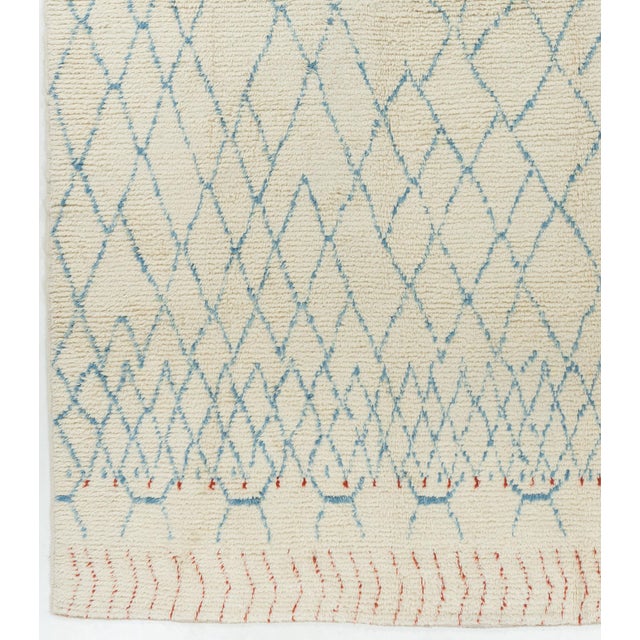 A Moroccan-inspired rug, handwoven in Turkey using the finest wools.