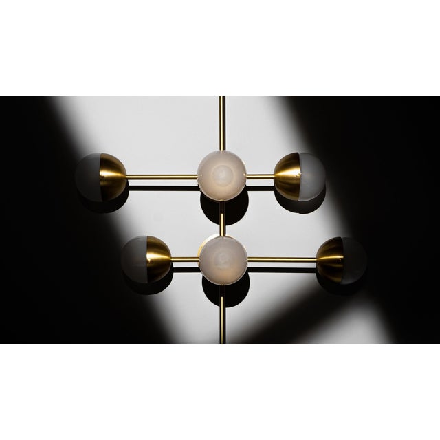 Recalling the basic elements of matter, this wall-mounted molecular model is composed of brass connections. The flush...