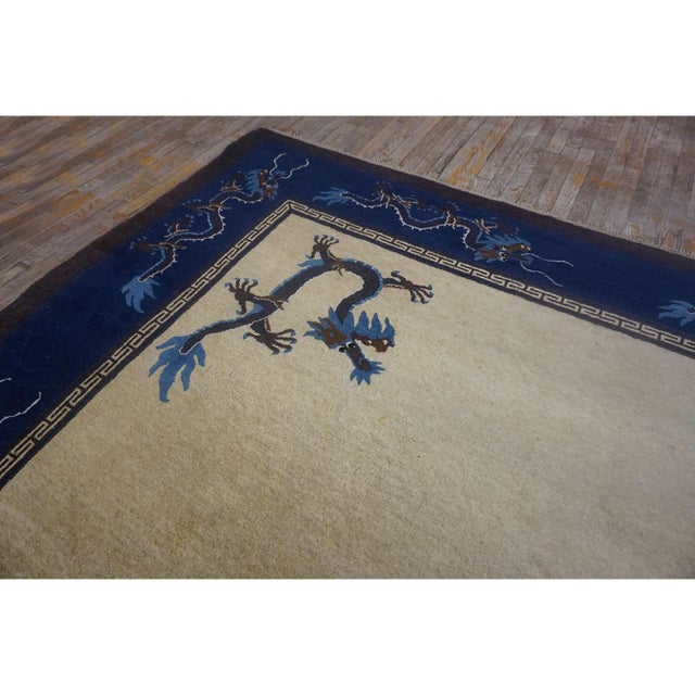 Chinese Antique Knotted 1900s Rectangle Wool - Peking Room Size Ivory Rug, Circa Date: 1900s. This exceptional example of...