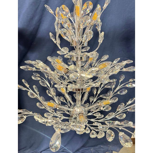 Beautiful crystal chandelier designed by James R. Moder. Note this has been in storage. One crystal piece is missing from...