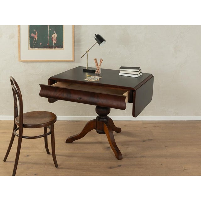 Wonderful antique desk from around 1890. High-quality solid beech wood frame in walnut veneer and solid beech wood table...