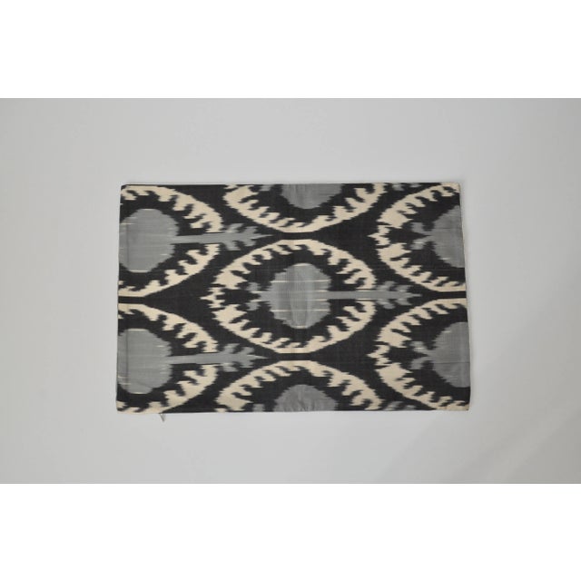 Beautiful black, ivory, and blue geometric silk velvet accent pillow with a different silk design on the back. It's like...